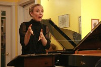 Annabelle Moseley reading her poetry at the String Poet Studio Series