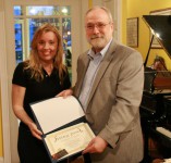 George H. Northrup receives his Runner-up award from String Poet Founder and Editor Annabelle Moseley